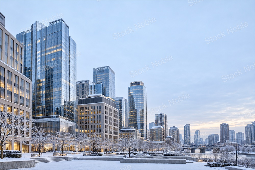 Modern Glass Towers Beside a Snowy Riverfront Plaza